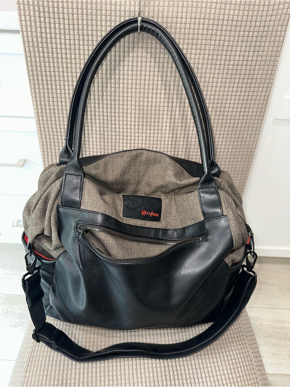Stylish and functional Cybex baby bag. Red lining. Could be a work bag too.